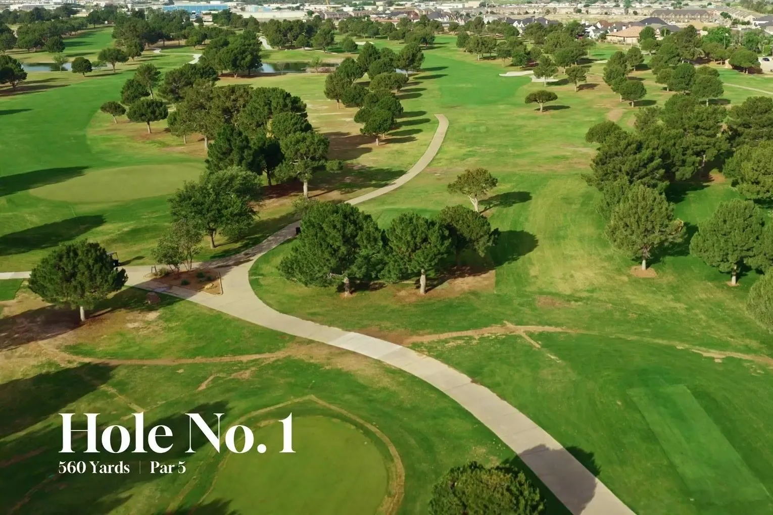Aerial flythrough still of Hole No. 1 at Odessa Country Club, The Old Course, looking down the fairway toward the green.